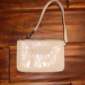 White Michael Kors wristlet.